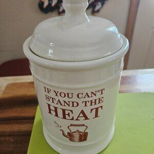 STONEWARE CANNISTER FEATUING A PHRASE ON FRONT